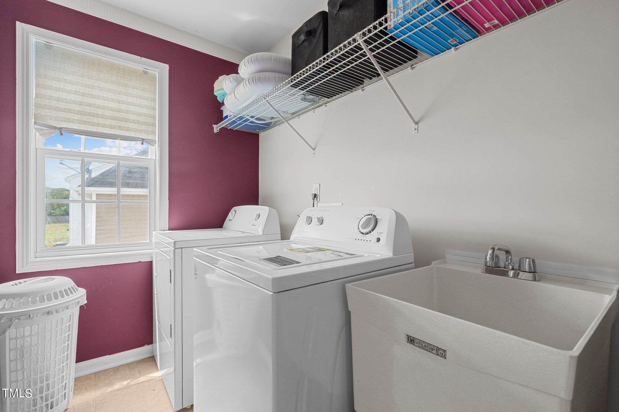 3930 Evans Drive Raleigh, NC 27610 - Photo 17 of 44 a utility room with dryer and washer