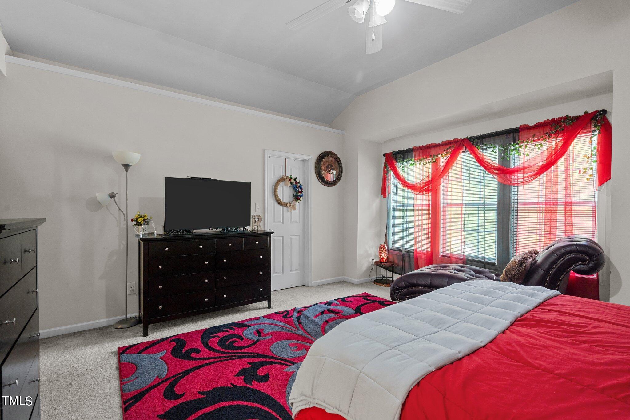 3930 Evans Drive Raleigh, NC 27610 - Photo 18 of 44 a bedroom with a bed and a flat screen tv