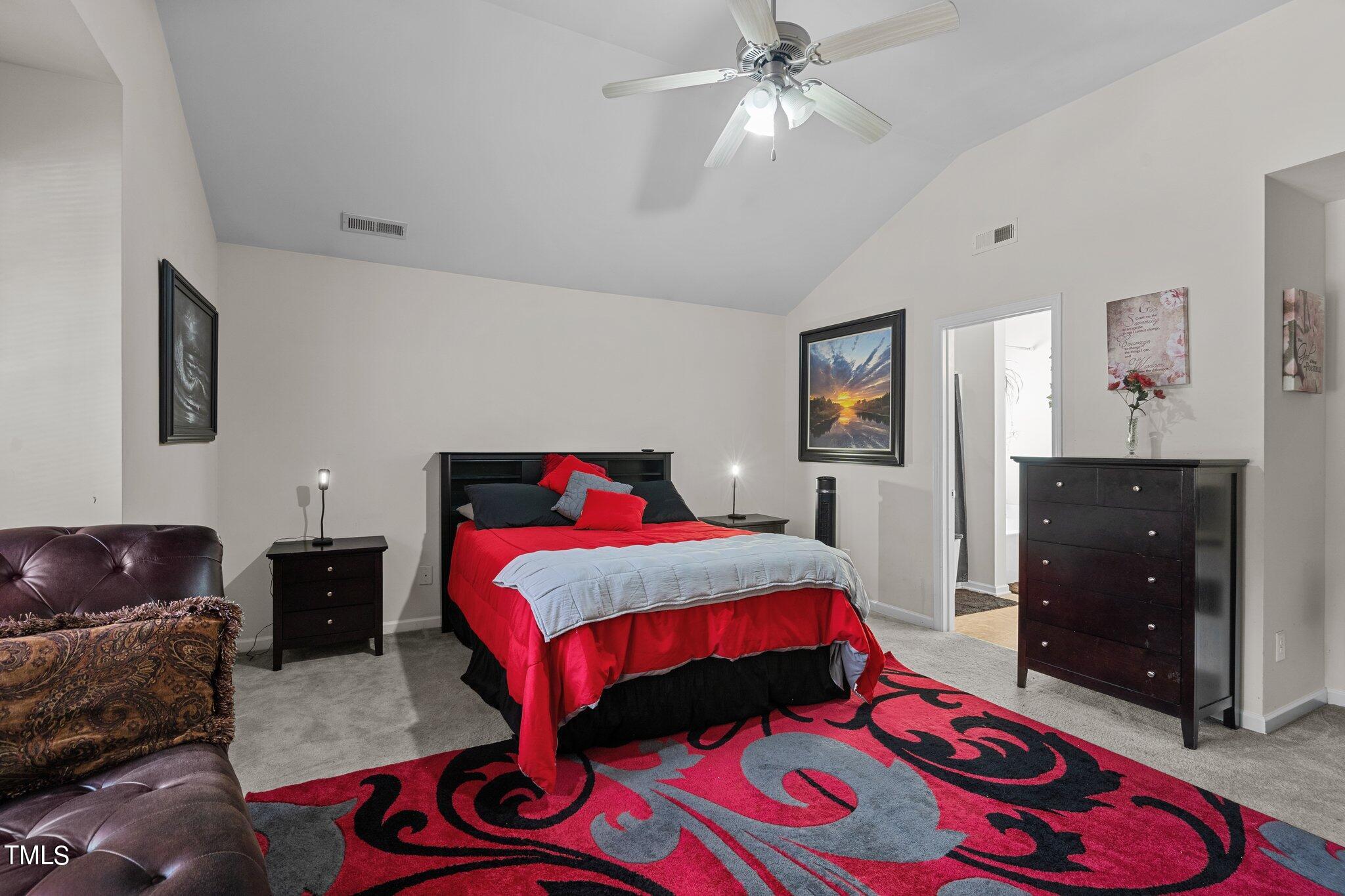 3930 Evans Drive Raleigh, NC 27610 - Photo 19 of 44 a bedroom with a bed and wooden floor