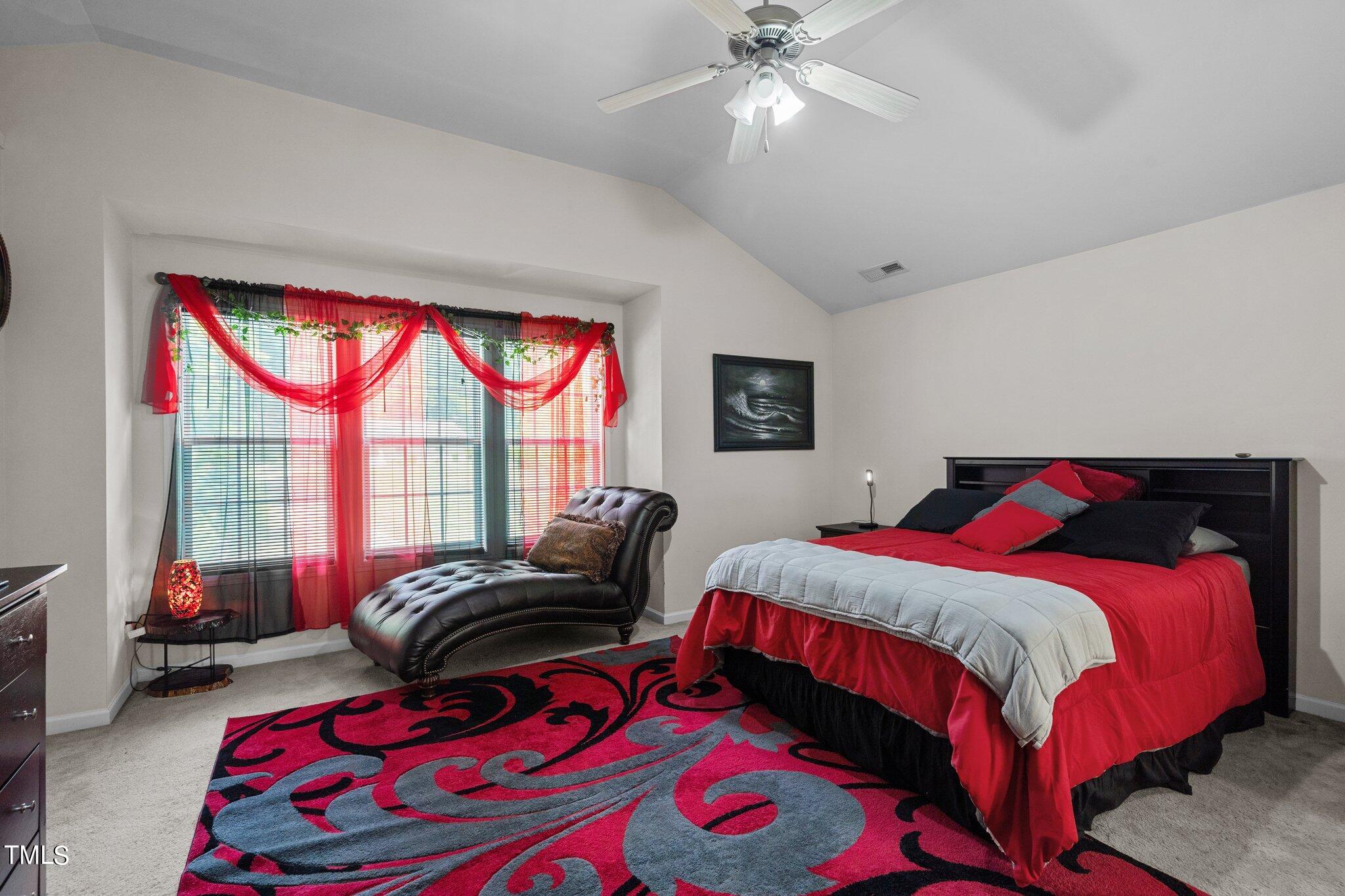3930 Evans Drive Raleigh, NC 27610 - Photo 20 of 44 a bedroom with a bed and a couch