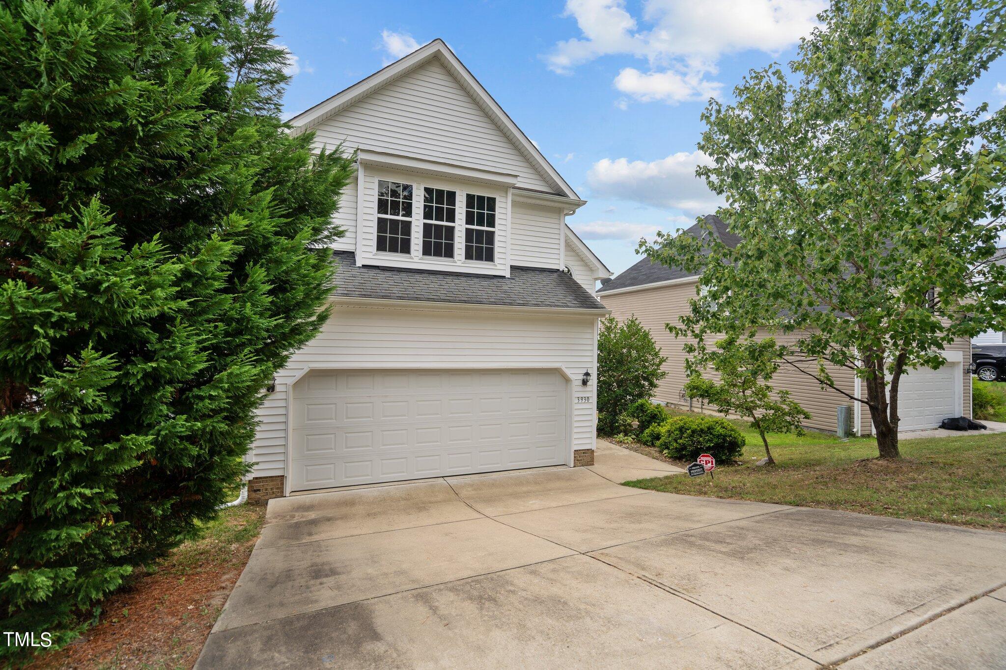 3930 Evans Drive Raleigh, NC 27610 - Photo 2 of 44 a front view of house with trees around