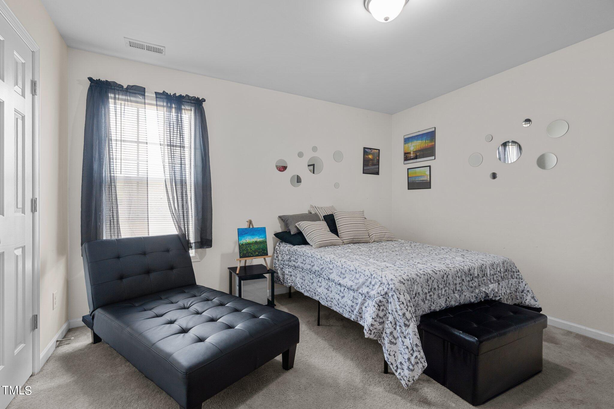 3930 Evans Drive Raleigh, NC 27610 - Photo 24 of 44 a bedroom with furniture and a window