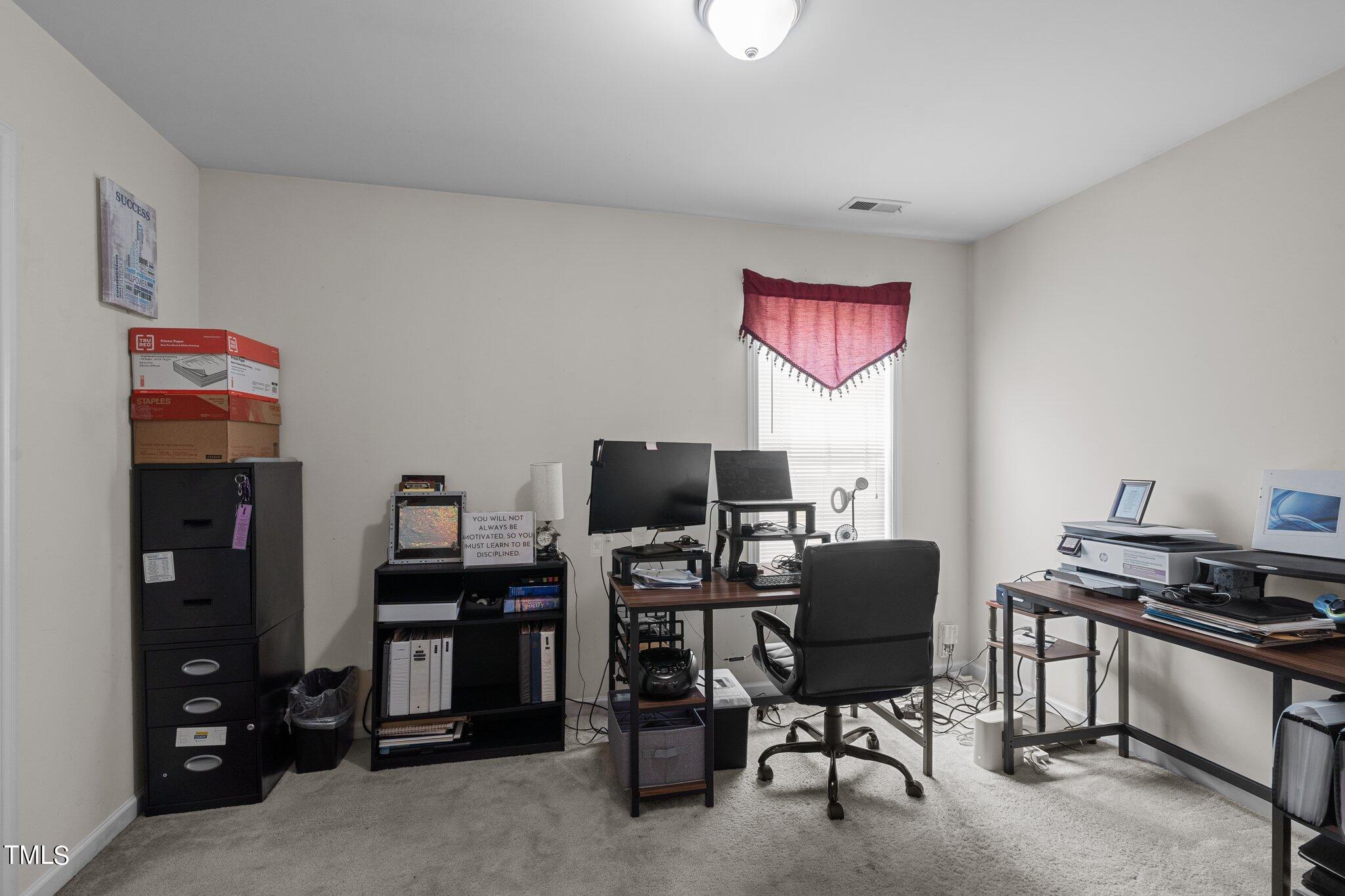 3930 Evans Drive Raleigh, NC 27610 - Photo 29 of 44 a view of a workspace with furniture