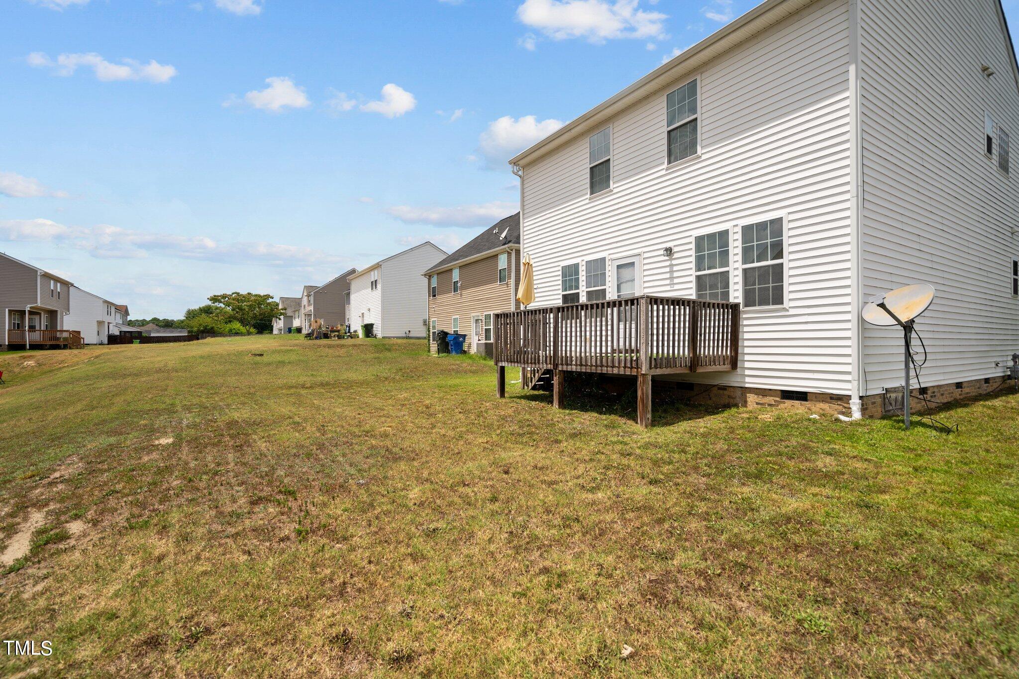 3930 Evans Drive Raleigh, NC 27610 - Photo 35 of 44 a view of a house with backyard and sitting area