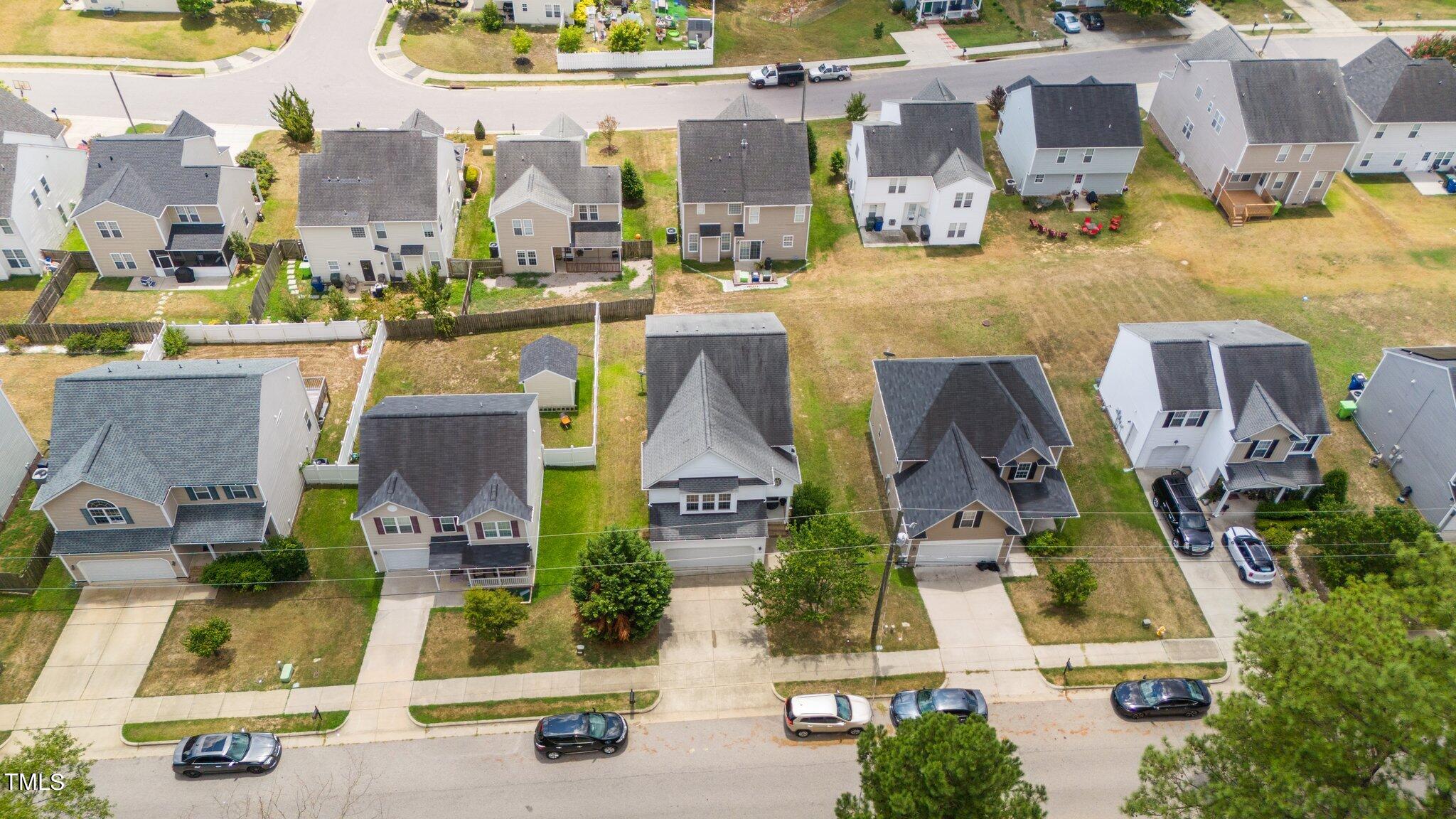 3930 Evans Drive Raleigh, NC 27610 - Photo 38 of 44 an aerial view of residential houses with outdoor space and parking