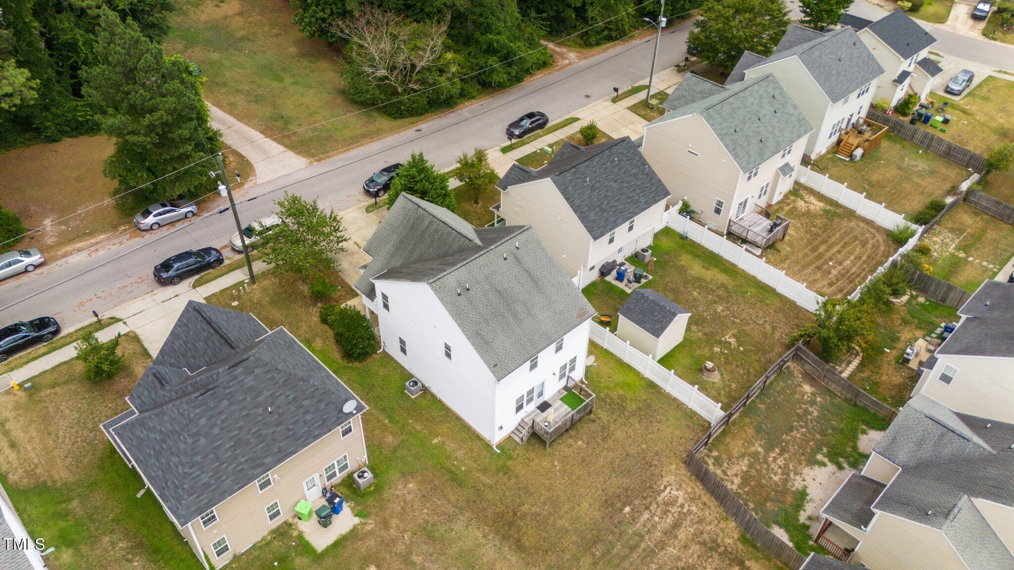 3930 Evans Drive Raleigh, NC 27610 - Photo 41 of 44 an aerial view of a house with a garden and swimming pool