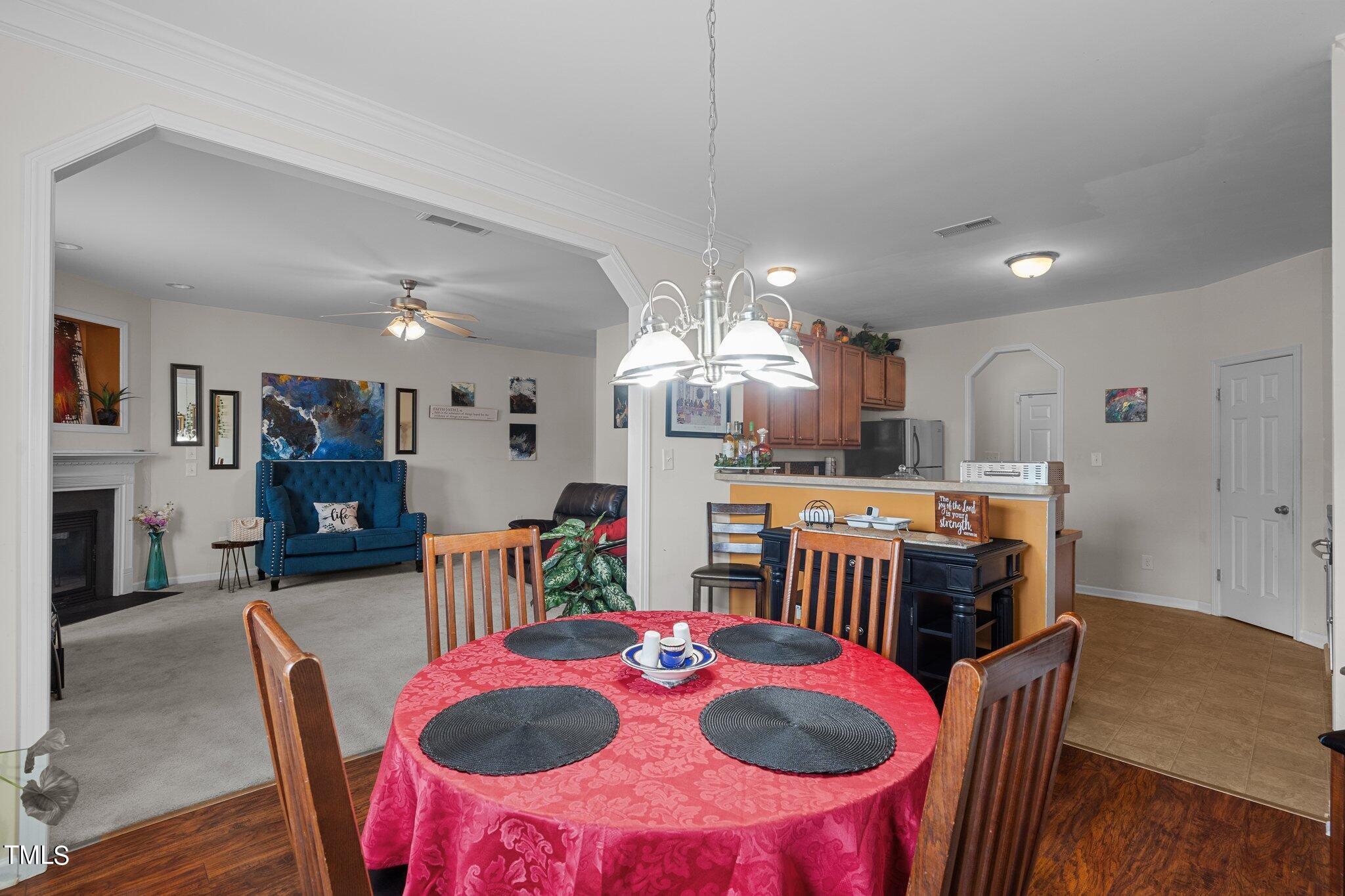 3930 Evans Drive Raleigh, NC 27610 - Photo 9 of 44 a dinning table and chairs in a kitchen