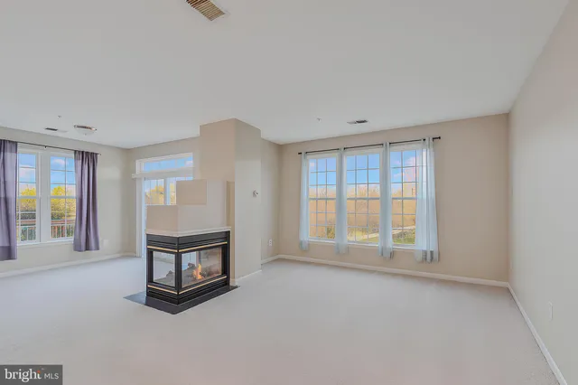 an empty room with windows