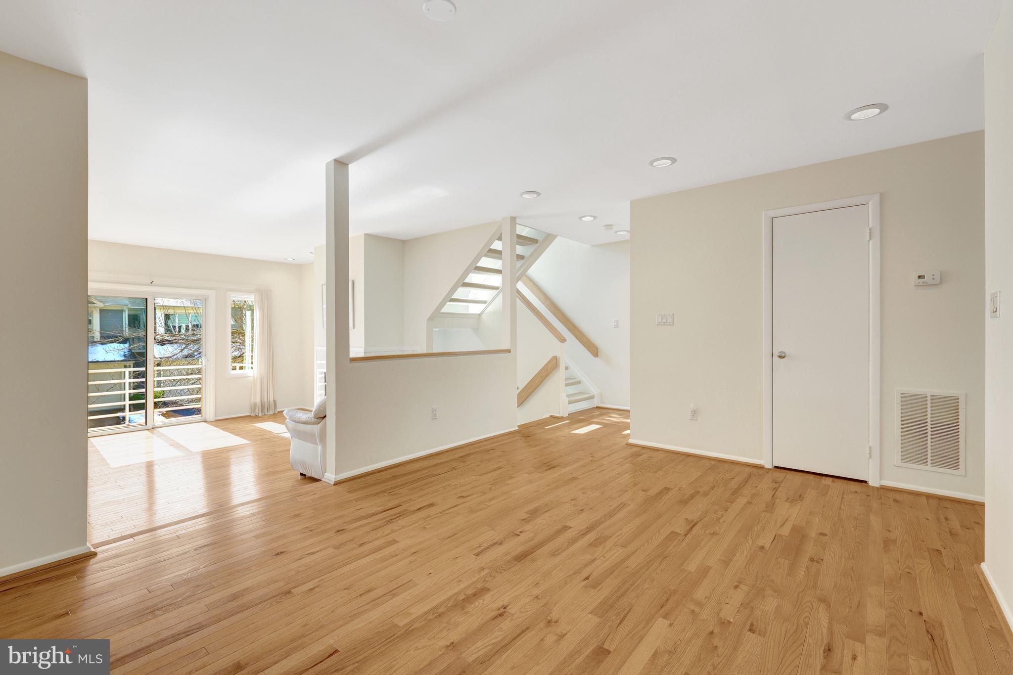 1926 Lakeport Way Reston, VA 20191 - Photo 11 of 54 The dining room opens to the living room.