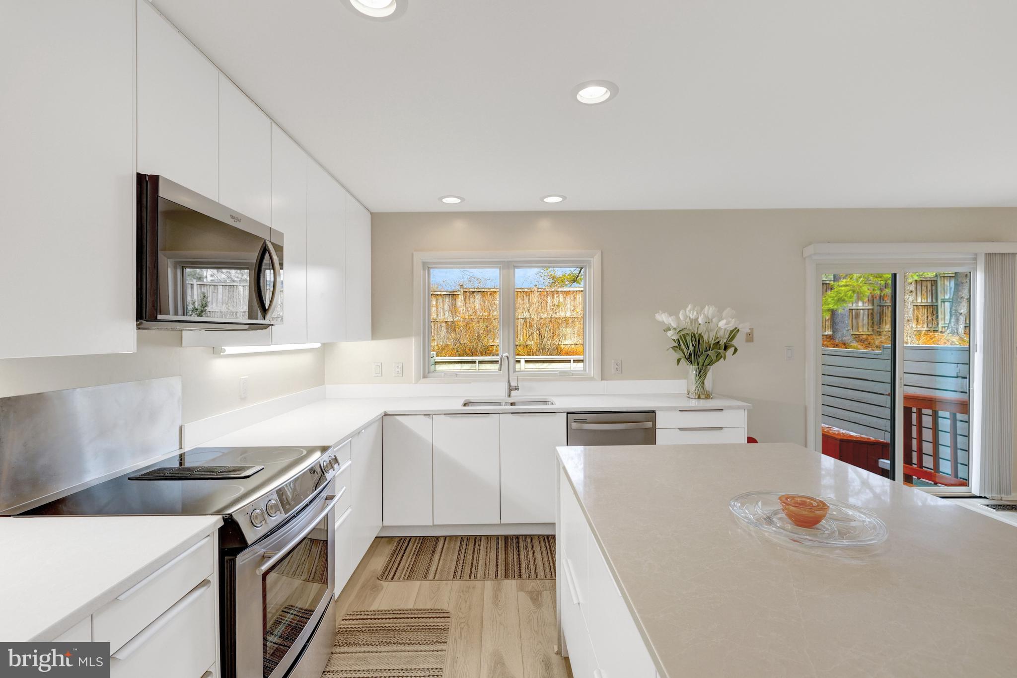 1926 Lakeport Way Reston, VA 20191 - Photo 14 of 54 Large windows overlook the back deck.