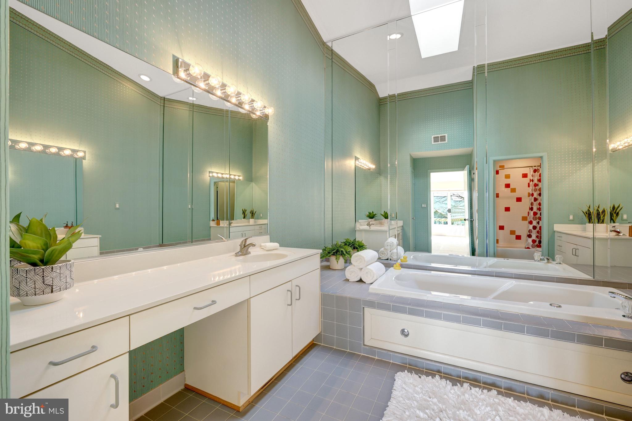 1926 Lakeport Way Reston, VA 20191 - Photo 26 of 54 The primary bath has a skylight and two vanities.