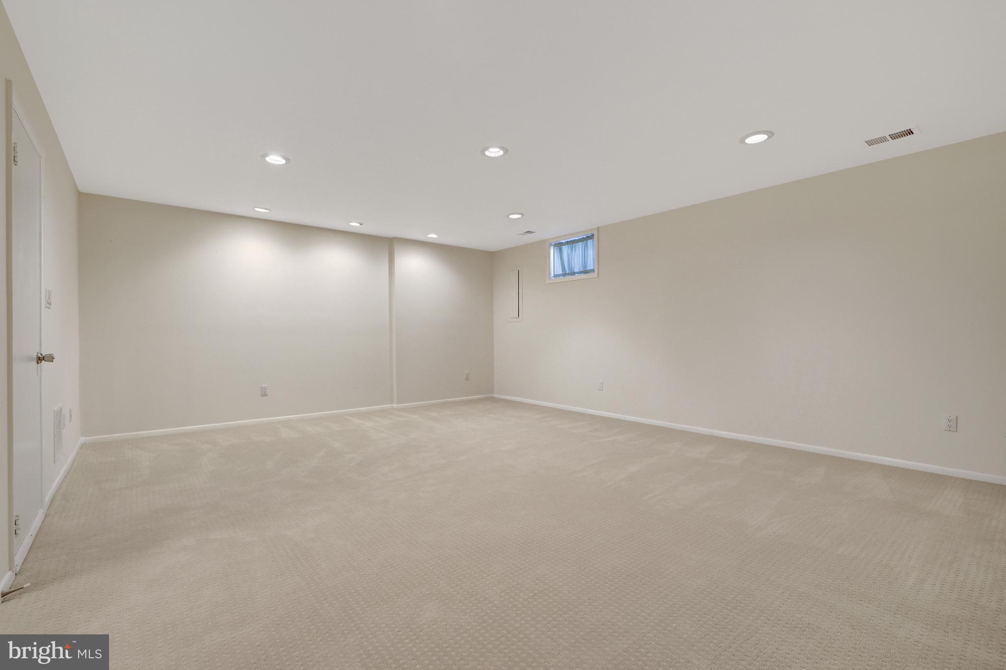 1926 Lakeport Way Reston, VA 20191 - Photo 38 of 54 Recreation room w/neutral carpet & recessed light.
