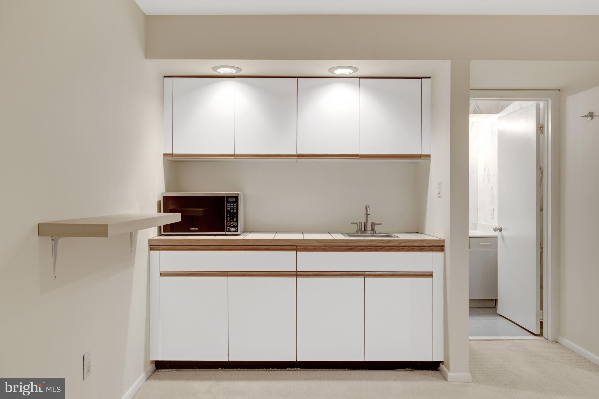 1926 Lakeport Way Reston, VA 20191 - Photo 40 of 54 The wet bar has great cabinet and counter space.