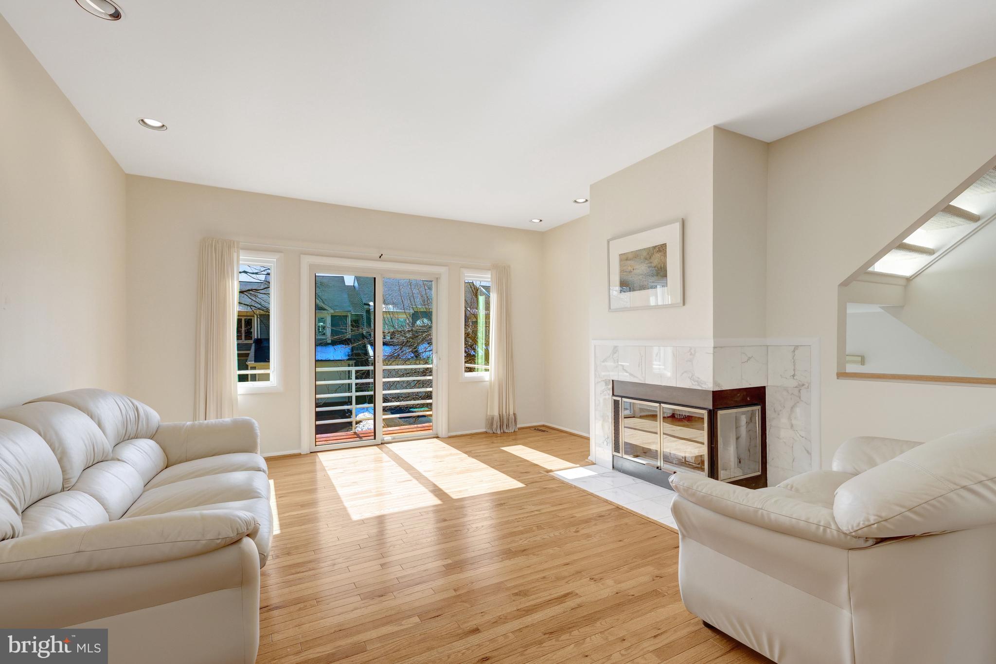 1926 Lakeport Way Reston, VA 20191 - Photo 6 of 54 Living room with sliding door to the front balcony
