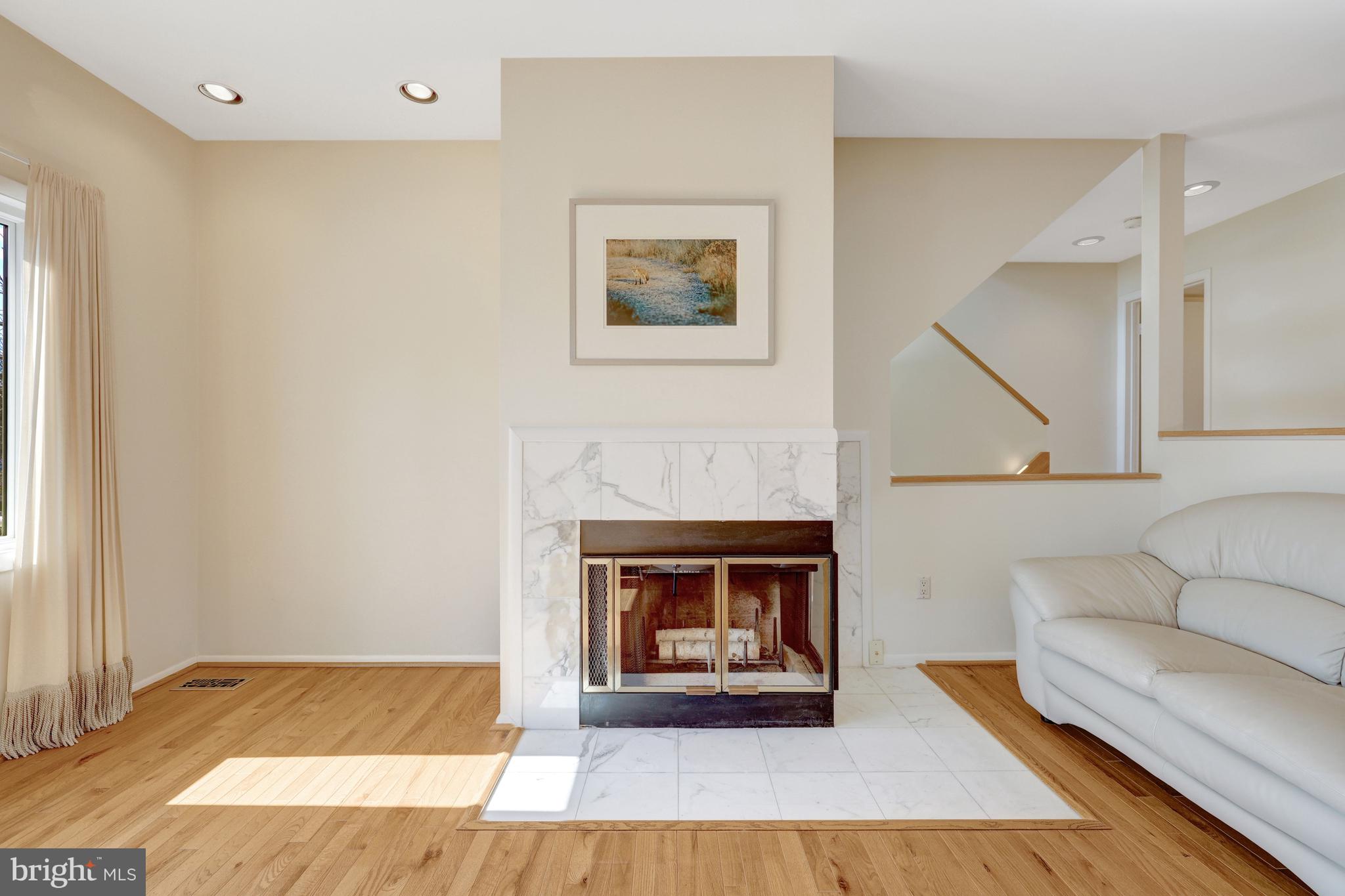 1926 Lakeport Way Reston, VA 20191 - Photo 8 of 54 Two-sided wood-burning fireplace w/marble surround