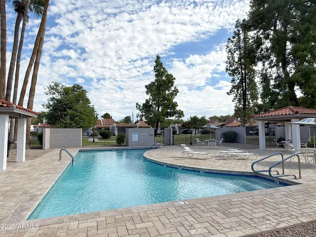 a view of a swimming pool with lounge chair