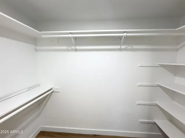 a view of an empty walk in closet