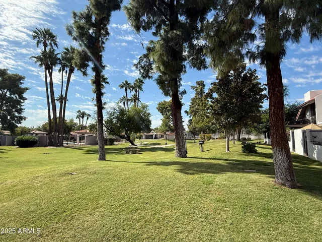 a view of a playground with basketball court