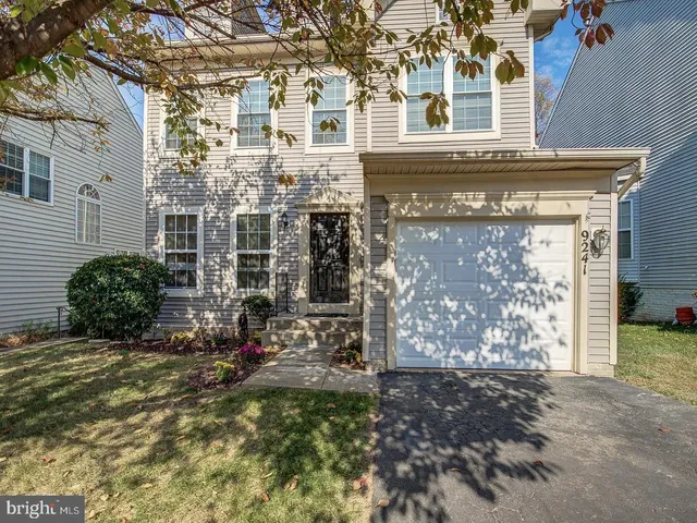 a view of a house with brick walls