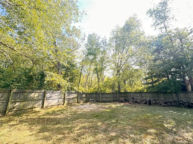 a bathroom with a toilet sink and shower
