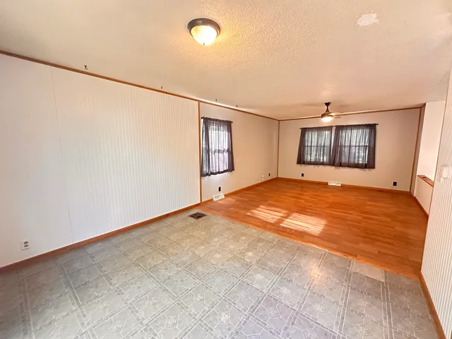 a big room with closet and windows