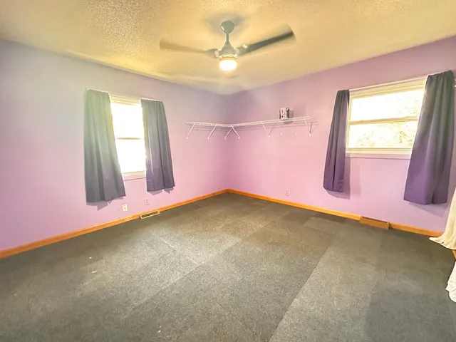 an empty room with windows