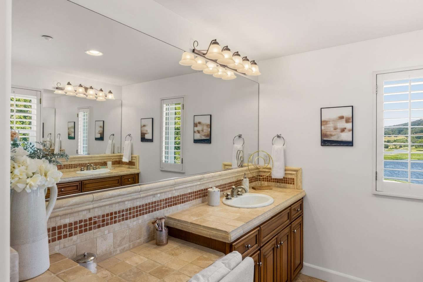 302 Pasadera Drive Monterey, CA 93940 - Photo 17 of 40 a bathroom with a sink a large mirror and a bathtub