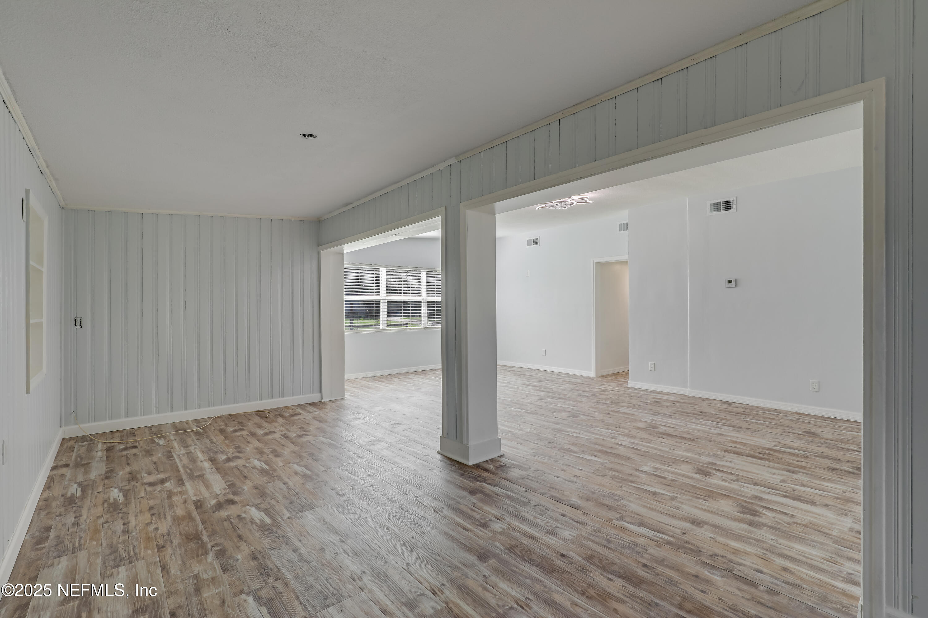 10524 Rutgers Road Jacksonville, FL 32218 - Photo 13 of 46 a view of empty room with wooden floor