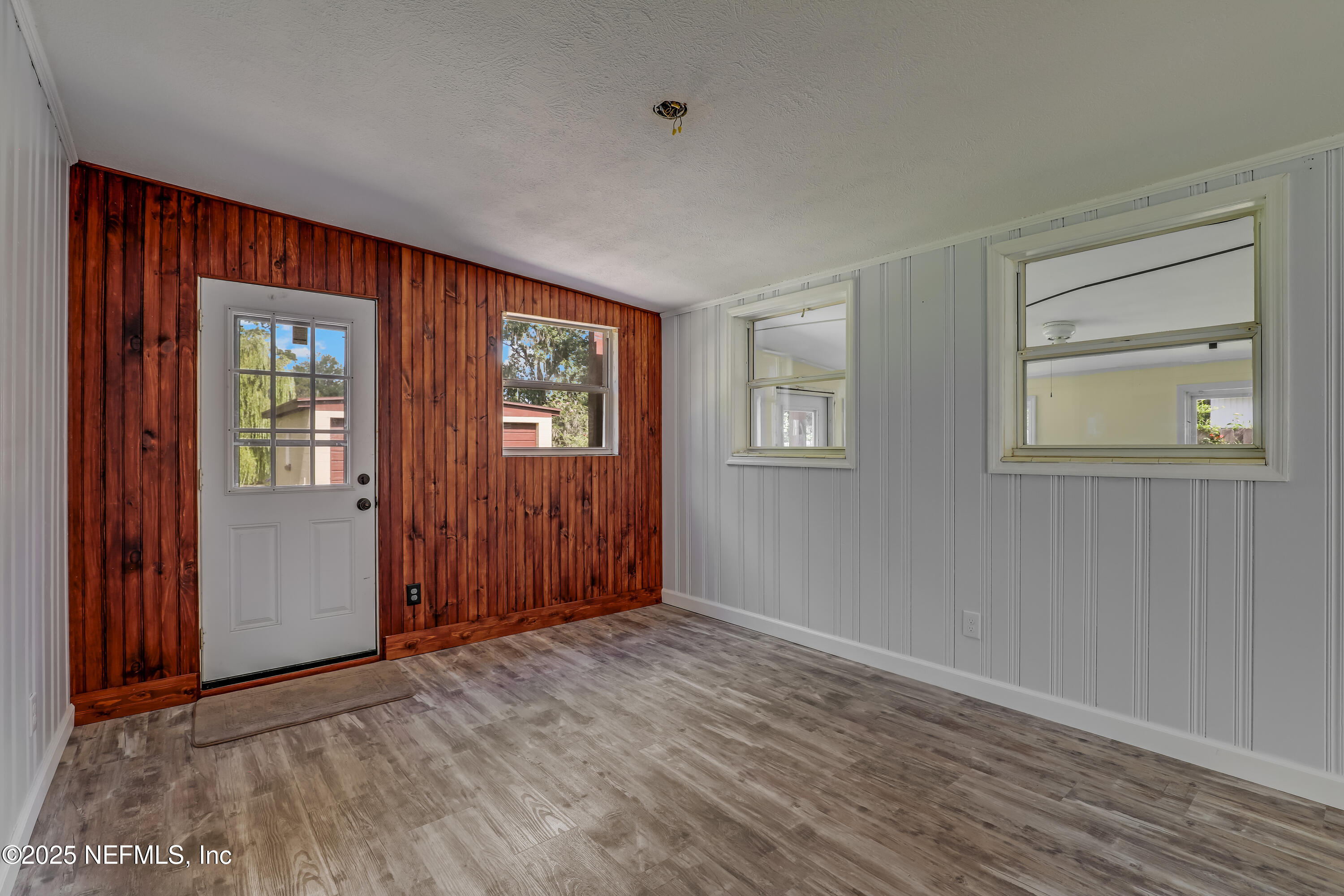 10524 Rutgers Road Jacksonville, FL 32218 - Photo 15 of 46 an empty room with windows and closet