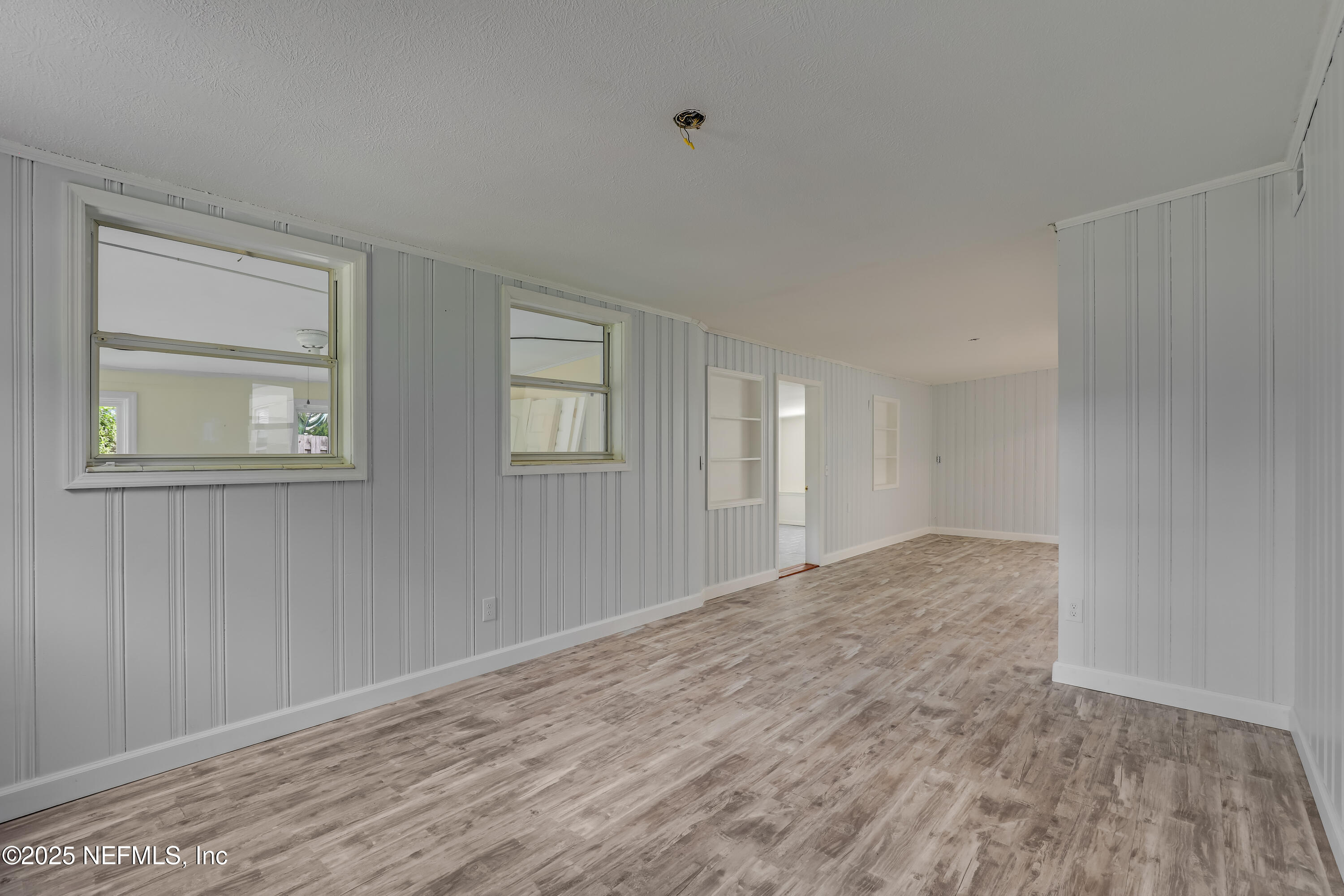 10524 Rutgers Road Jacksonville, FL 32218 - Photo 16 of 46 a view of empty room with wooden floor