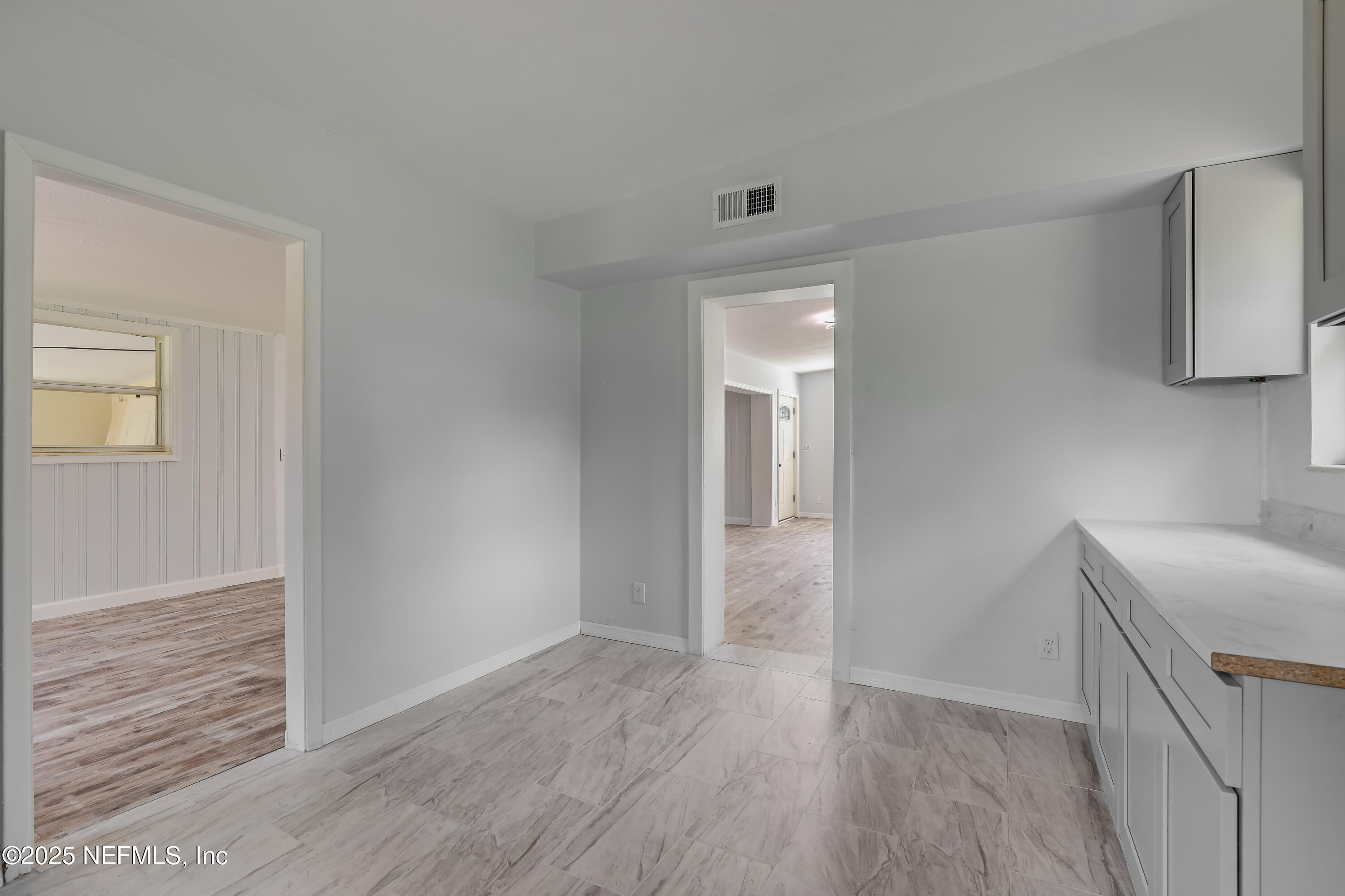 10524 Rutgers Road Jacksonville, FL 32218 - Photo 20 of 46 an empty room with wooden floor and closet