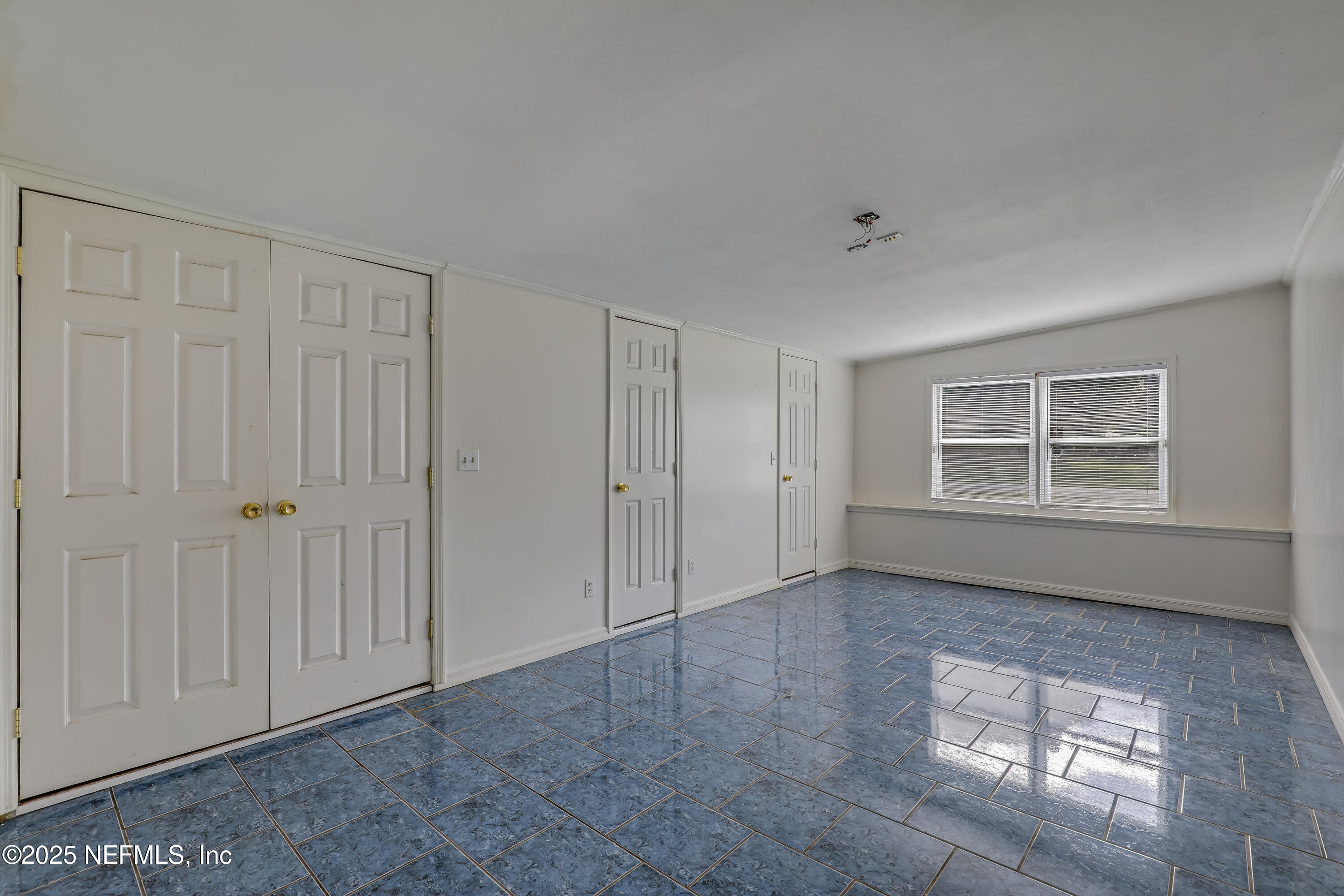 10524 Rutgers Road Jacksonville, FL 32218 - Photo 21 of 46 an empty room with windows