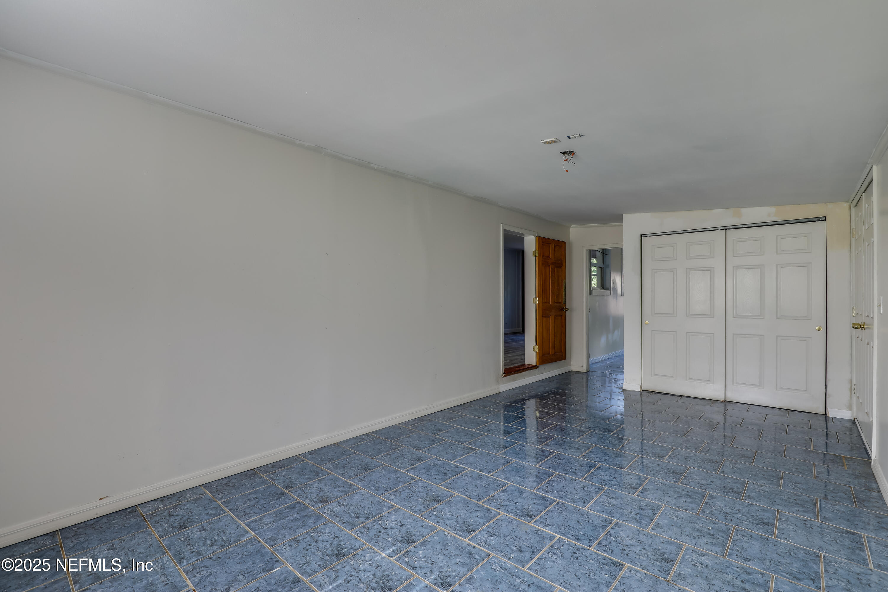 10524 Rutgers Road Jacksonville, FL 32218 - Photo 23 of 46 a view of an empty room and window