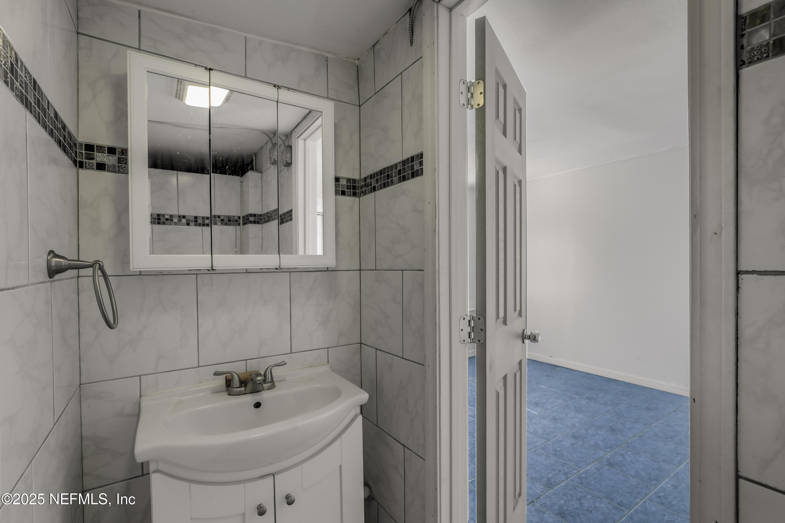 10524 Rutgers Road Jacksonville, FL 32218 - Photo 26 of 46 a bathroom with a sink and shower