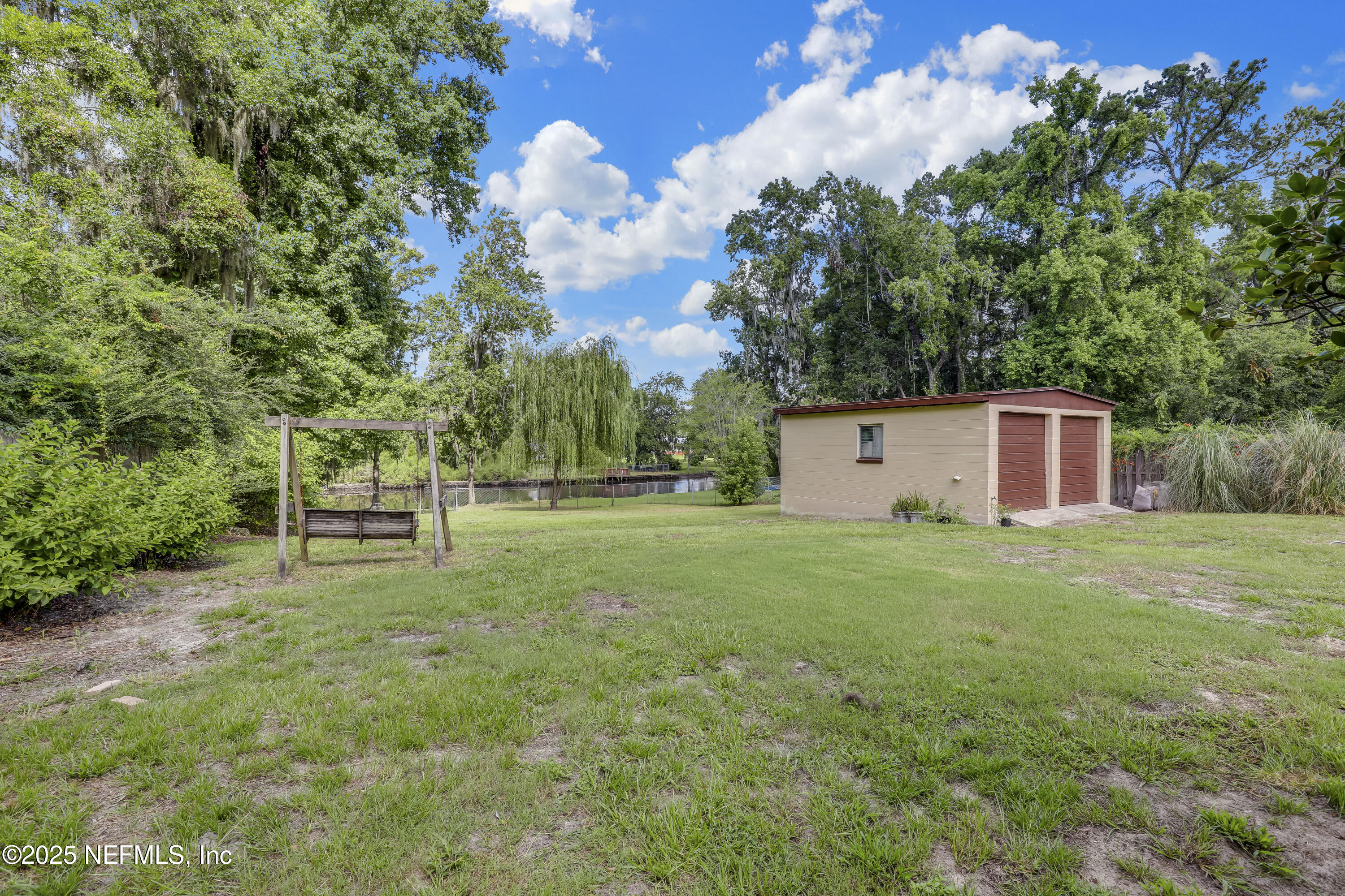 10524 Rutgers Road Jacksonville, FL 32218 - Photo 37 of 46 a backyard of a house with lots of green space
