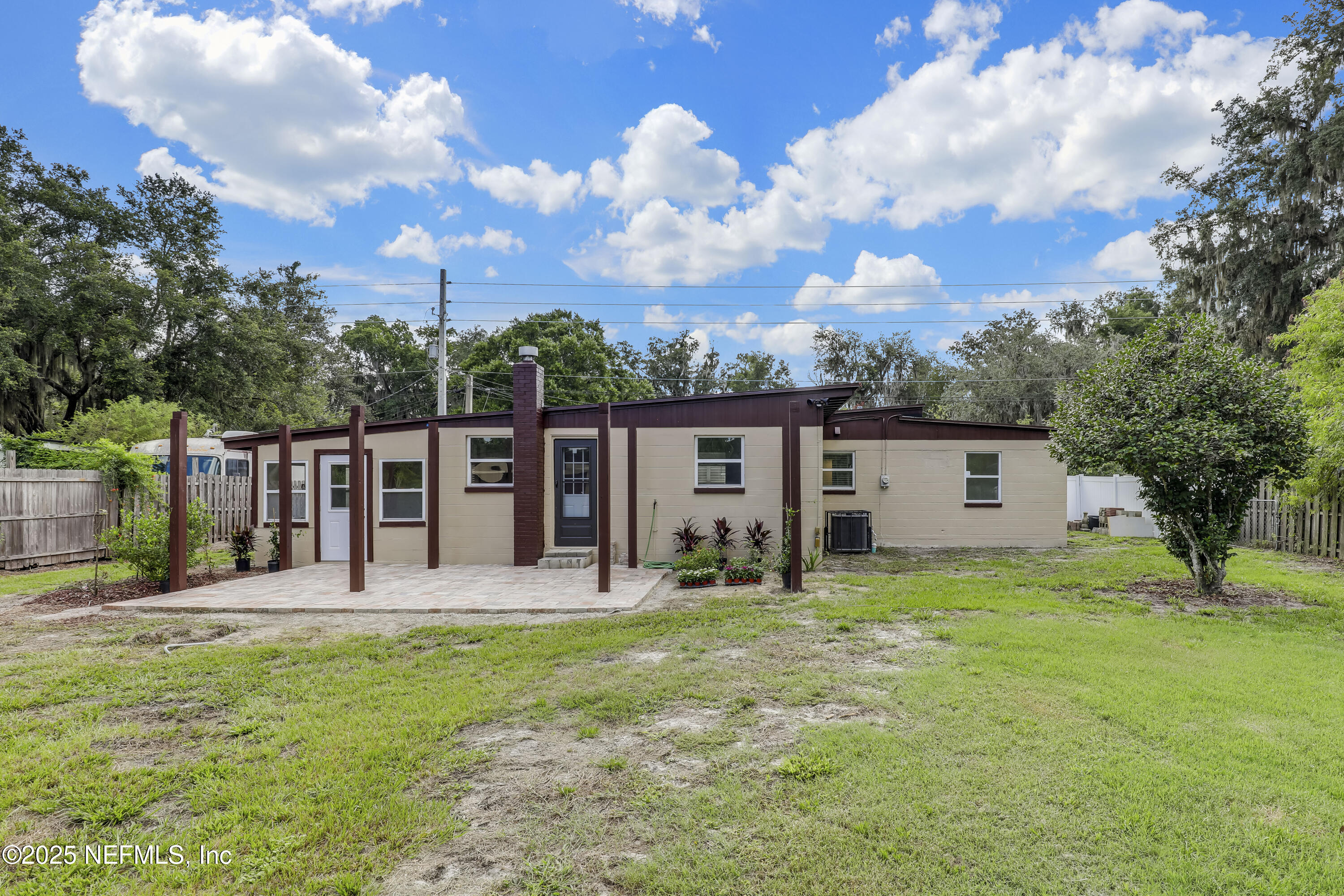 10524 Rutgers Road Jacksonville, FL 32218 - Photo 38 of 46 a view of a house with backyard porch and sitting area