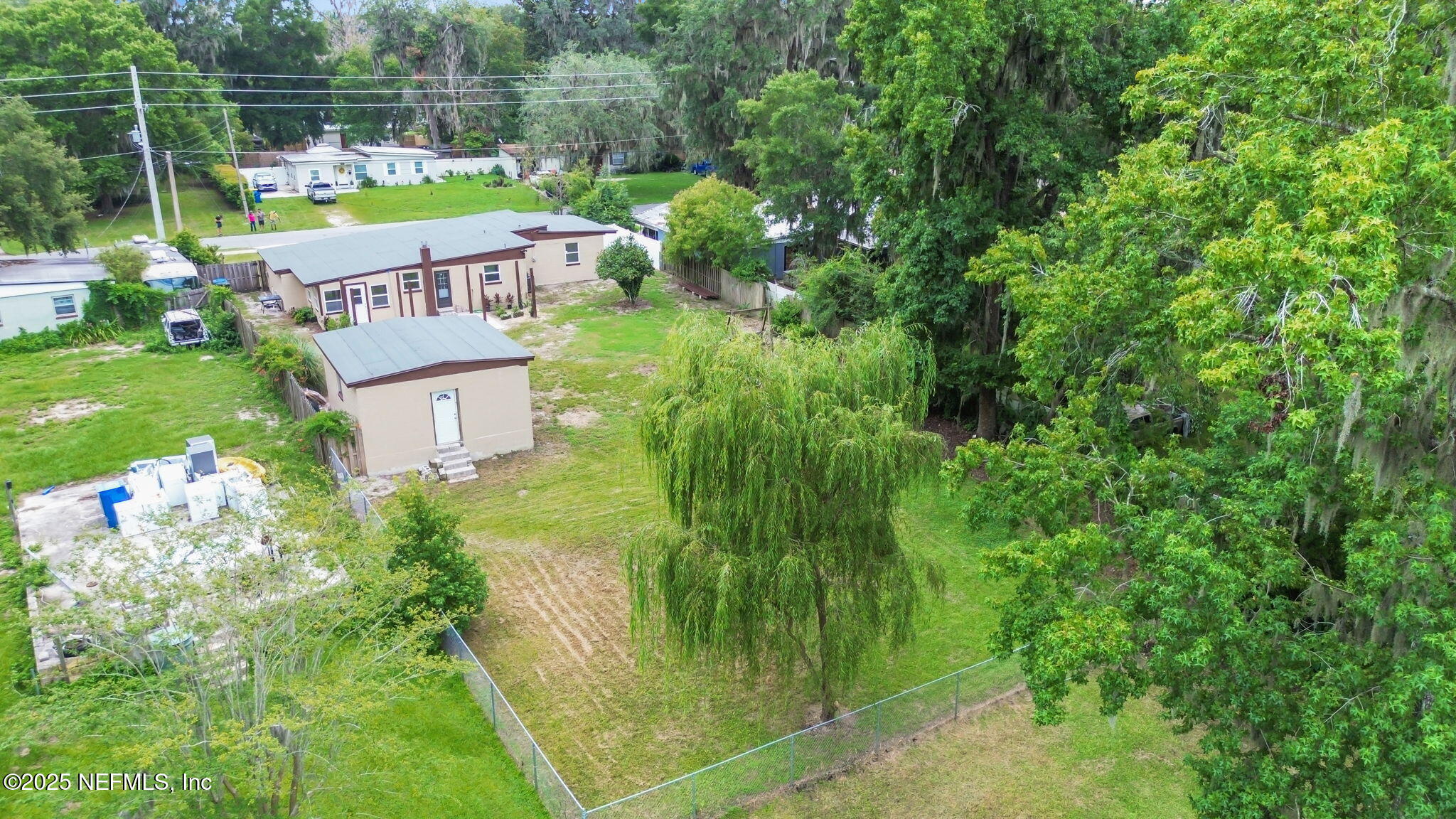 10524 Rutgers Road Jacksonville, FL 32218 - Photo 43 of 46 a view of a house with a yard