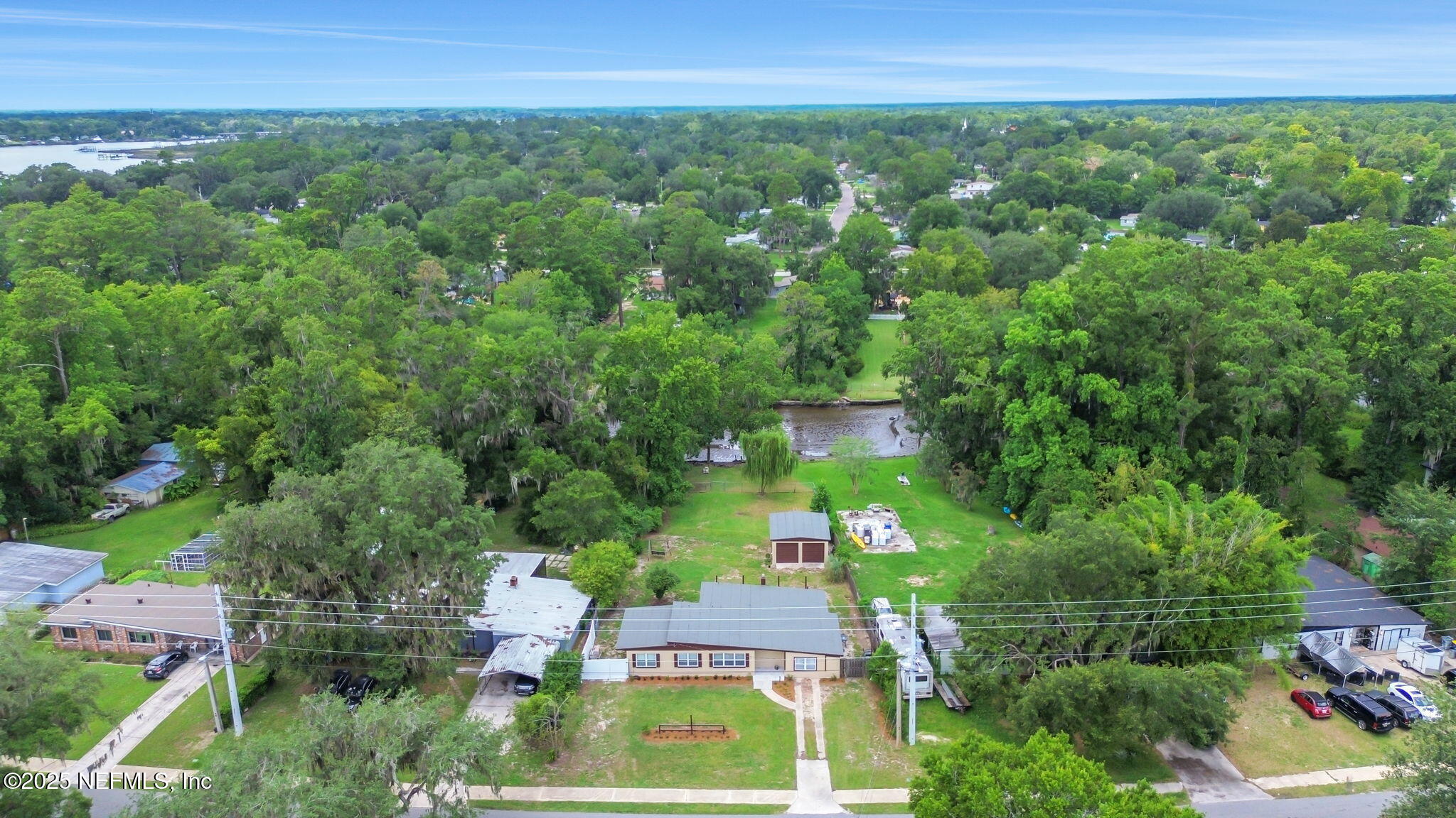 10524 Rutgers Road Jacksonville, FL 32218 - Photo 44 of 46 an aerial view of residential house with outdoor space and trees all around
