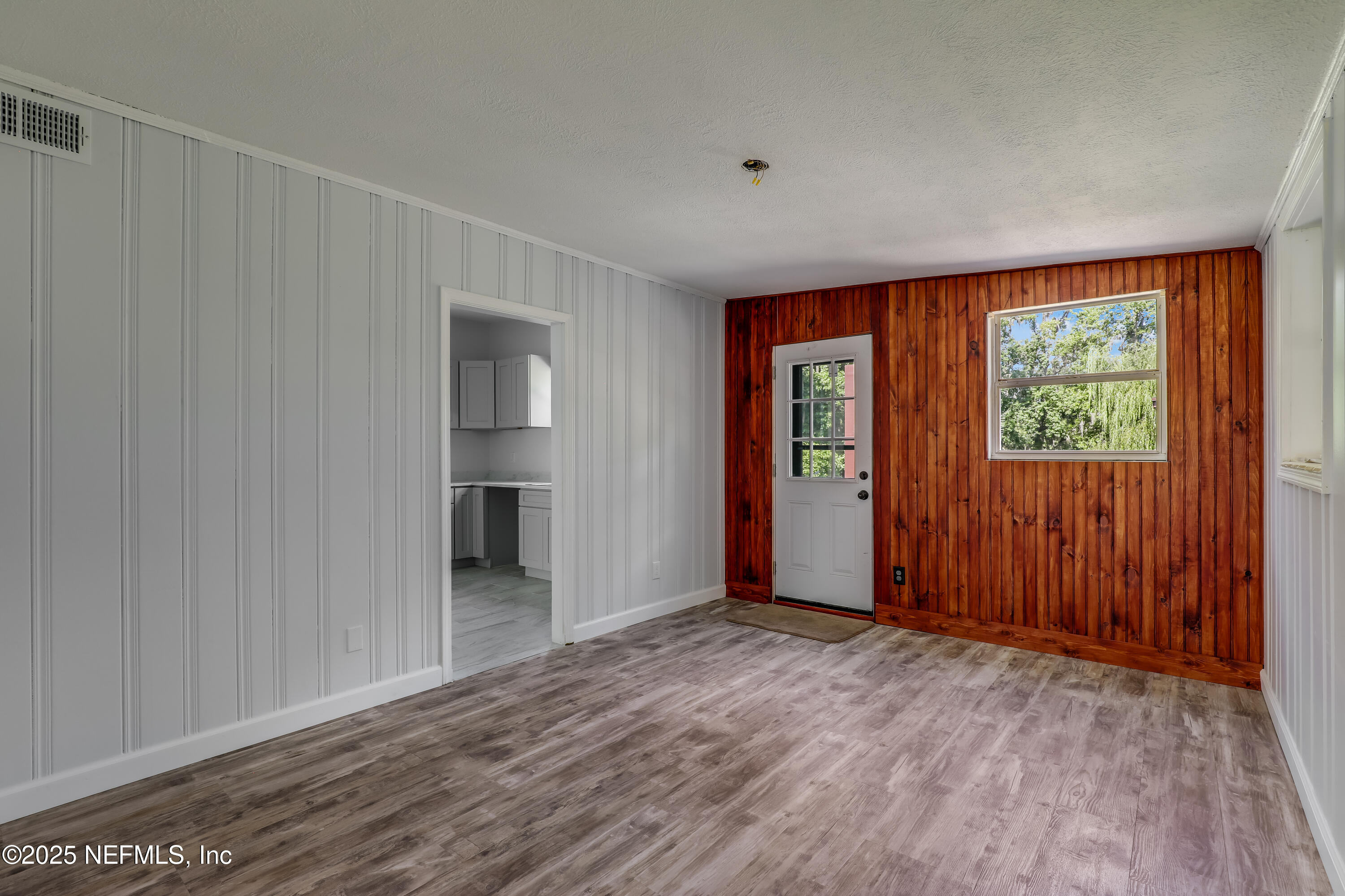 10524 Rutgers Road Jacksonville, FL 32218 - Photo 6 of 46 an empty room with windows and closet