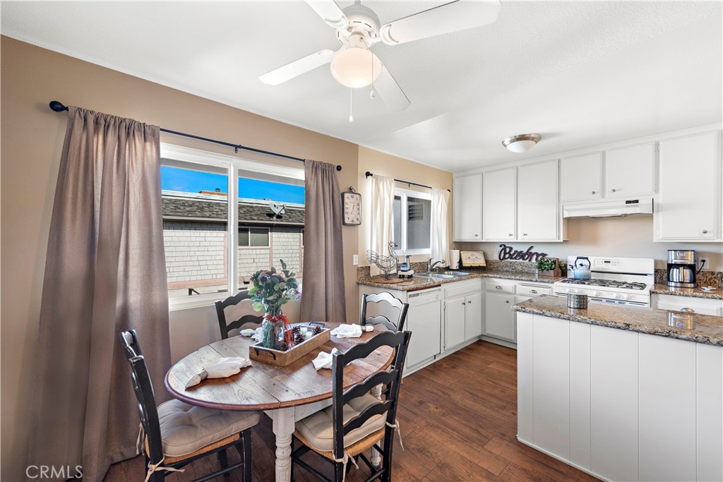 34081 Colegio Drive Dana Point, CA 92629 - Photo 24 of 34 a kitchen with sink a microwave and dining table