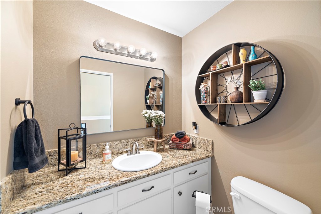 34081 Colegio Drive Dana Point, CA 92629 - Photo 26 of 34 a bathroom with a granite countertop and a mirror