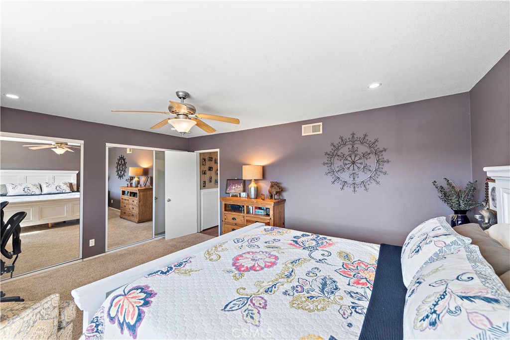 34081 Colegio Drive Dana Point, CA 92629 - Photo 29 of 34 a bedroom with a bed and a chandelier