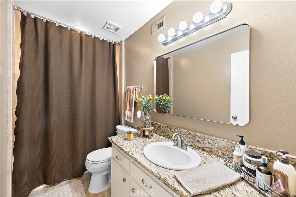 34081 Colegio Drive Dana Point, CA 92629 - Photo 30 of 34 a bathroom with a sink vanity mirror and toilet