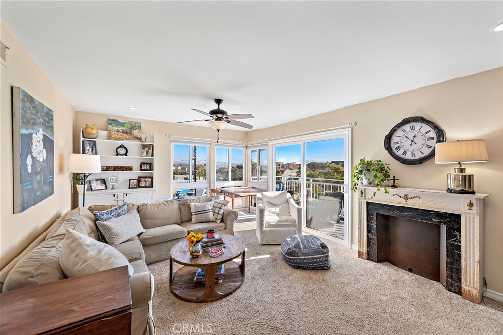 34081 Colegio Drive Dana Point, CA 92629 - Photo 4 of 34 a living room with furniture a fireplace and a large window
