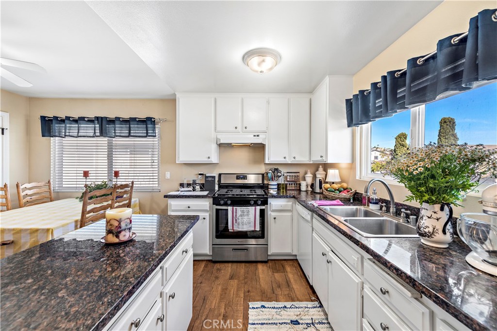 34081 Colegio Drive Dana Point, CA 92629 - Photo 7 of 34 a kitchen with stainless steel appliances granite countertop a sink stove and cabinets