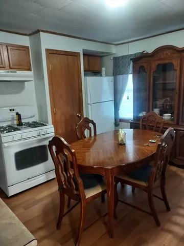 a view of a kitchen with workspace and a window