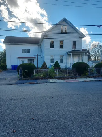 a house that has a big yard in front of it