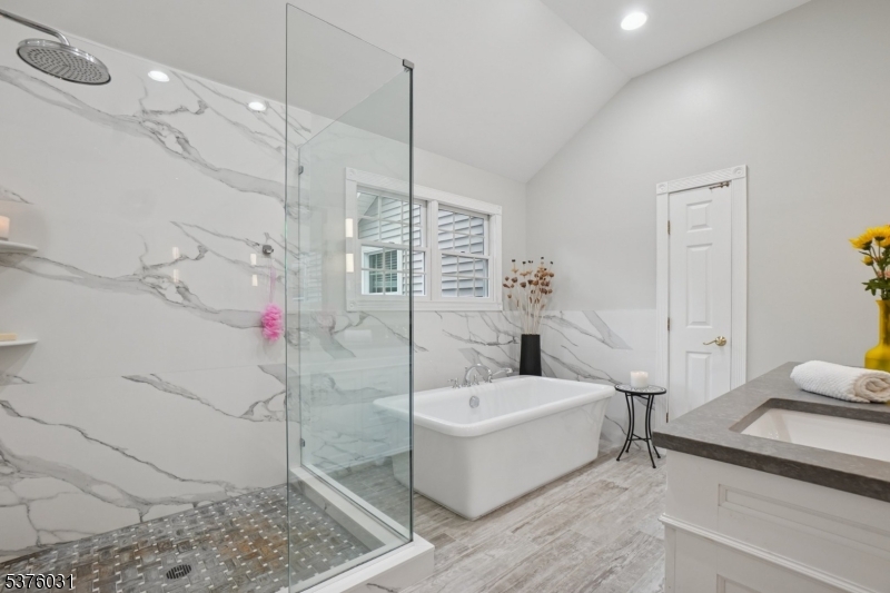 21 Spring Street Chatham, NJ 07928 - Photo 32 of 48 a bathroom with a bathtub and a shower