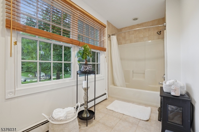 21 Spring Street Chatham, NJ 07928 - Photo 36 of 48 a bathroom with a sink toilet and shower