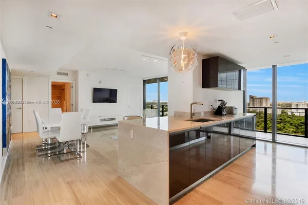 a view of living room kitchen and dining room